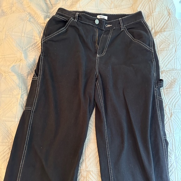 Black Garage Cargo Pants, with white stitching on the side. - Picture 1 of 4